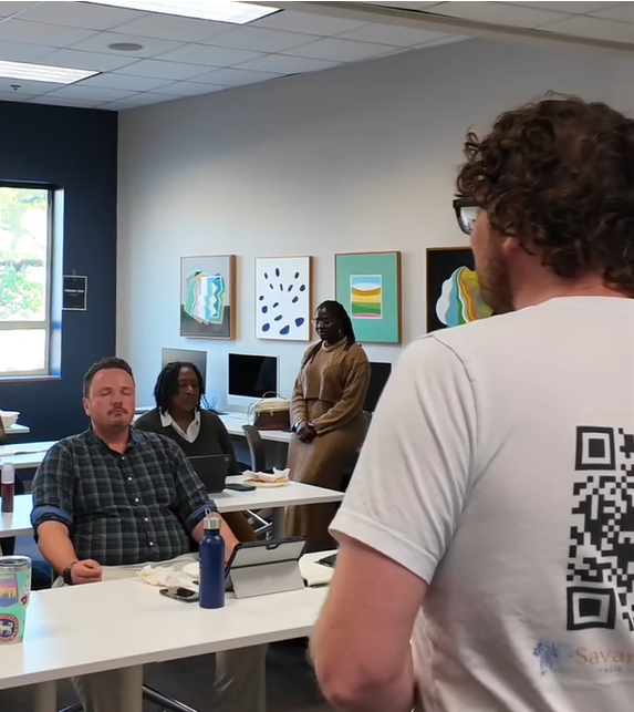 Chase Barber teaching an audience in a classroom setting